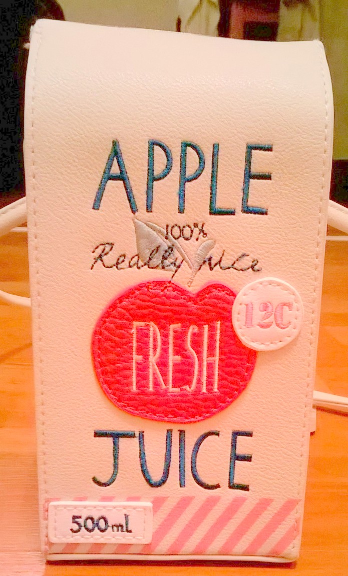 Accessorize apple juice carton bag